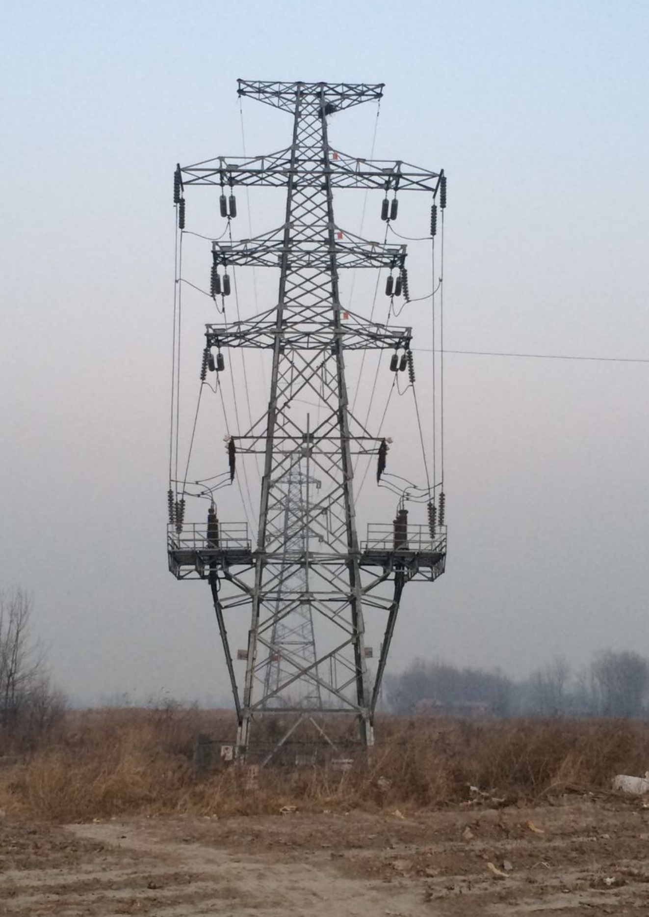 transmission lines and grey clouds behind